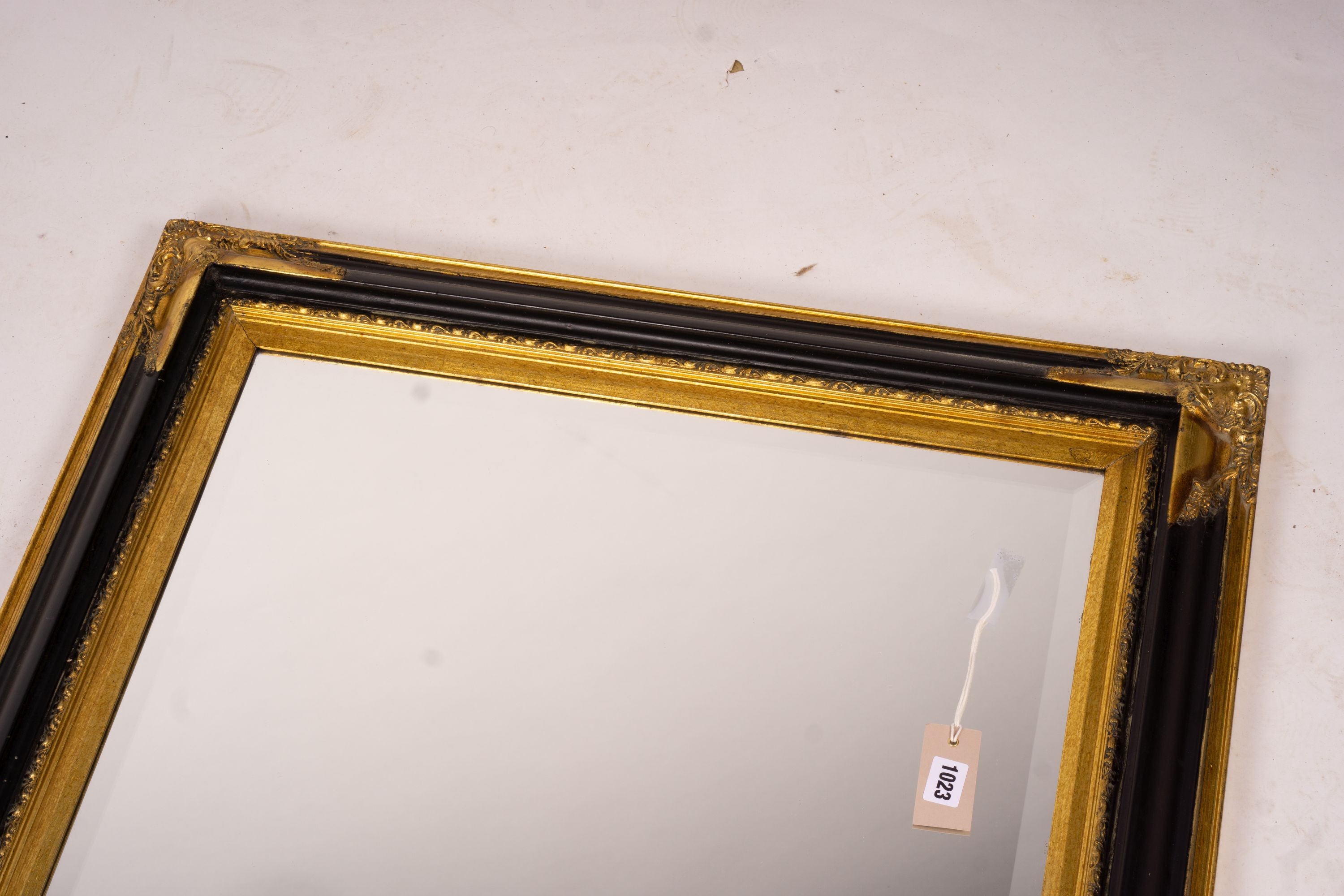 A 19th century French gilt gesso wall mirror, width 64cm, height 116cm together with a modern larger rectangular wall mirror